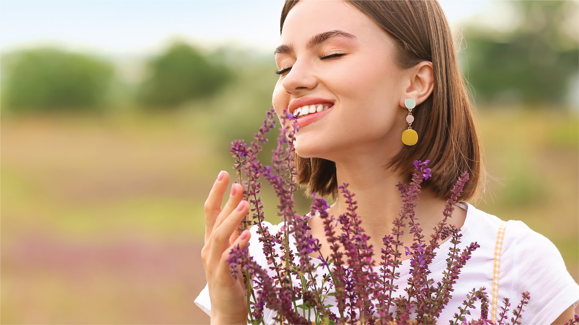 woman with earrings and flowers